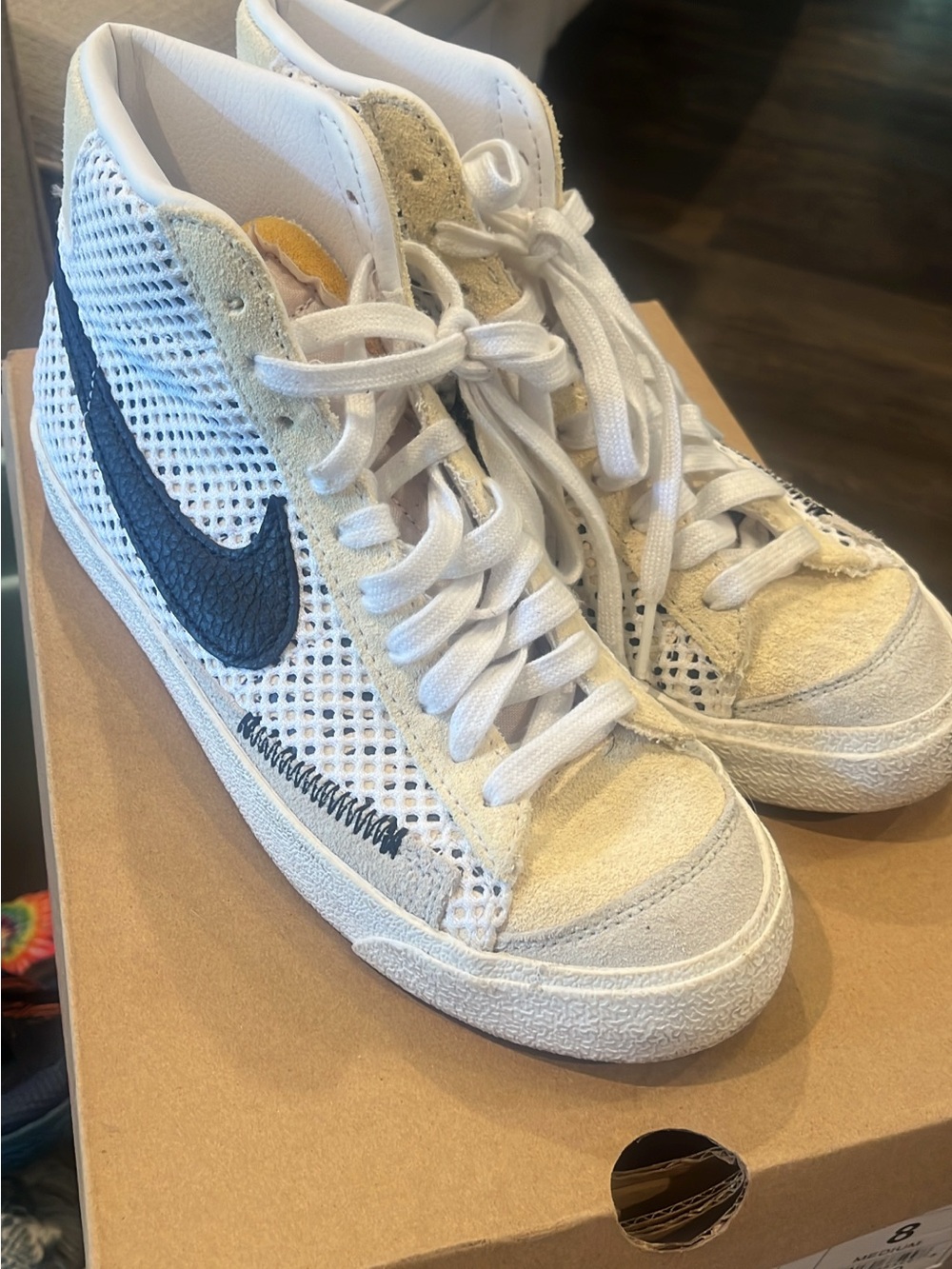 Nike Women’s High-Top Sneaker in White with Navy Swoosh